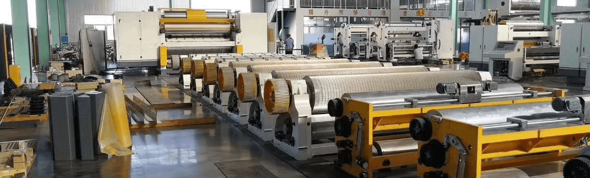 Corrugated paperboard production line makes paper reel into paperboards